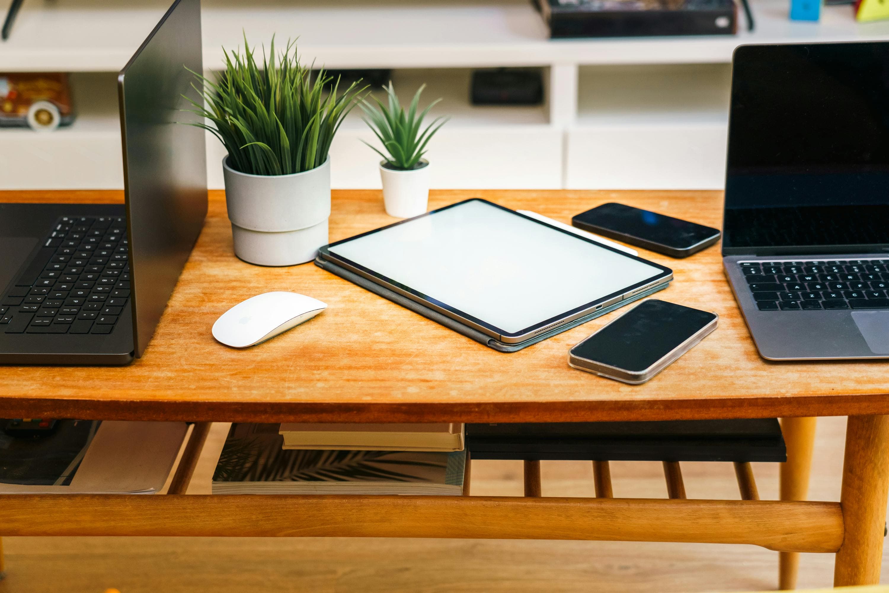 Table with many electronic devices on it.