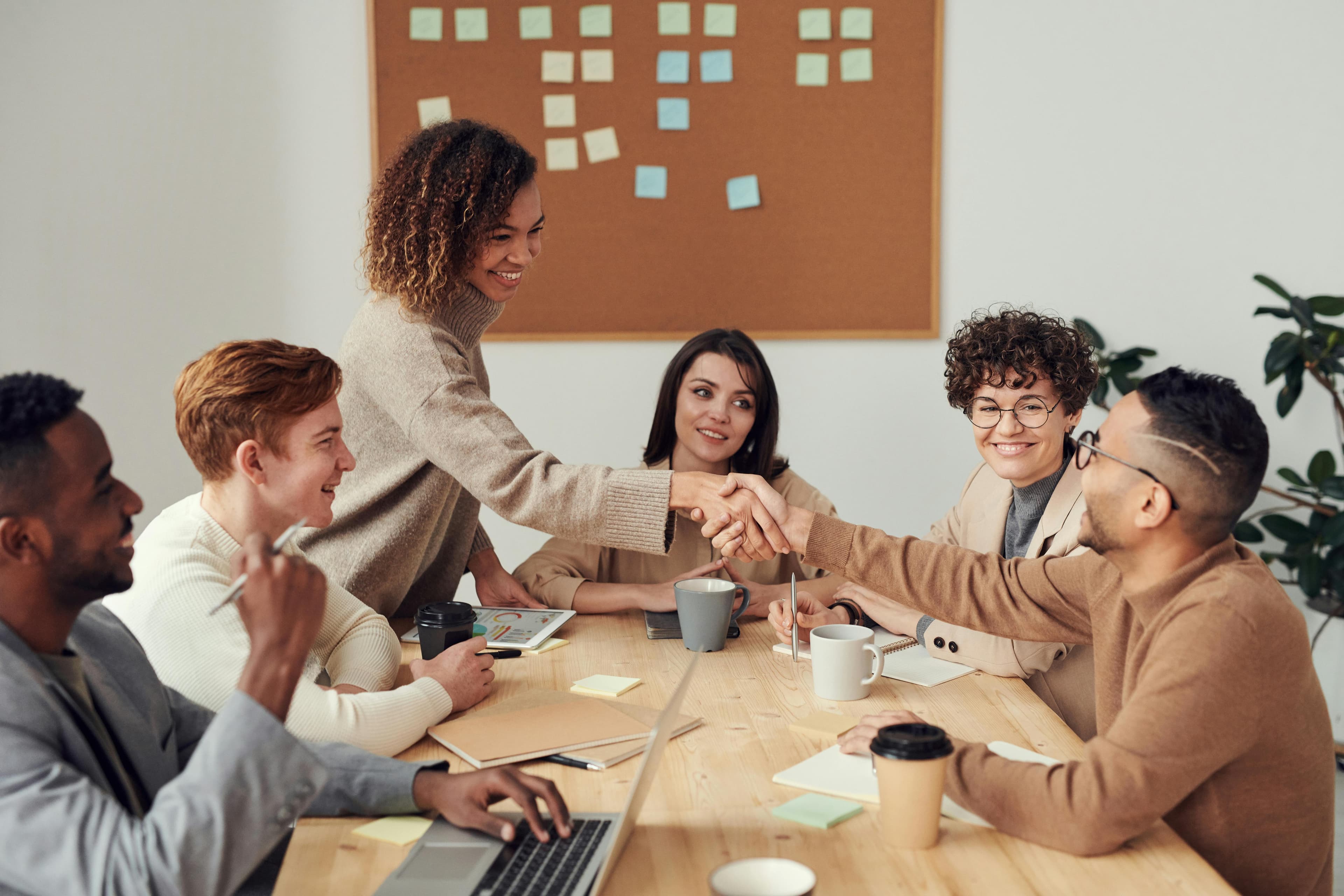 Group of co-workers around a table collaborating.